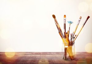 Brushes in a glass jar