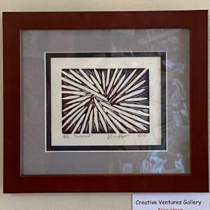 Framed abstract print, "Twisted" by Alex Haas, features sharp black lines radiating on a white background.