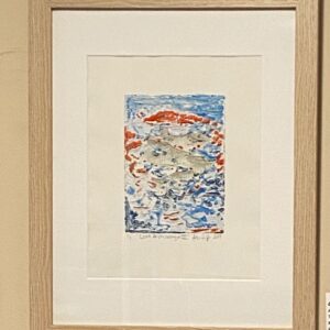 Lost Archipelago III" by Alexander Haas: framed abstract on white paper in red, blue, and gray, on a beige wall.