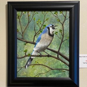 Spring Song - Blue Jay" by Brenda Ferro: a framed painting of a blue jay on budding branches with a green background.