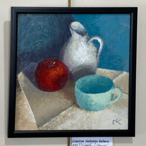 Coffee Time" by Elizabeth Craumer: a still life with a white pitcher, red apple, and blue cup on beige cloth.