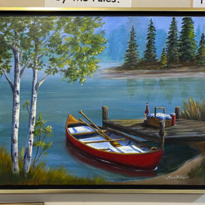 “A Day on the Lake” by Eileen Belanger features a red canoe by a dock, birches, and a picnic on a calm lakeside pier.