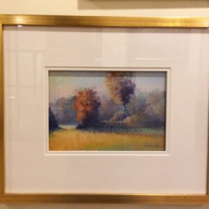 Autumn Palette" by Elizabeth Craumer—a framed landscape of trees and fields—hangs on a light wall with a side label.