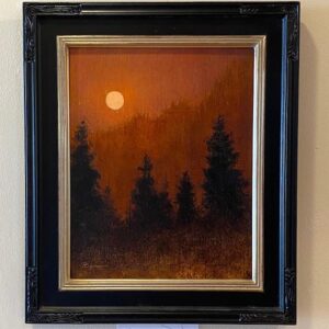 Silhouettes" by Phil Bean: a framed forest silhouette painting with an orange sunset sky, displayed on a wall.