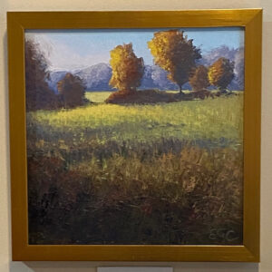 Touch of Fall" by Elizabeth Craumer: a framed sunlit field with shadowed trees, mountains, and EGC initials.