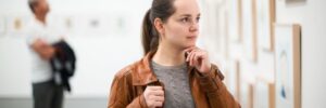 portrait of adult brunette woman in art museum